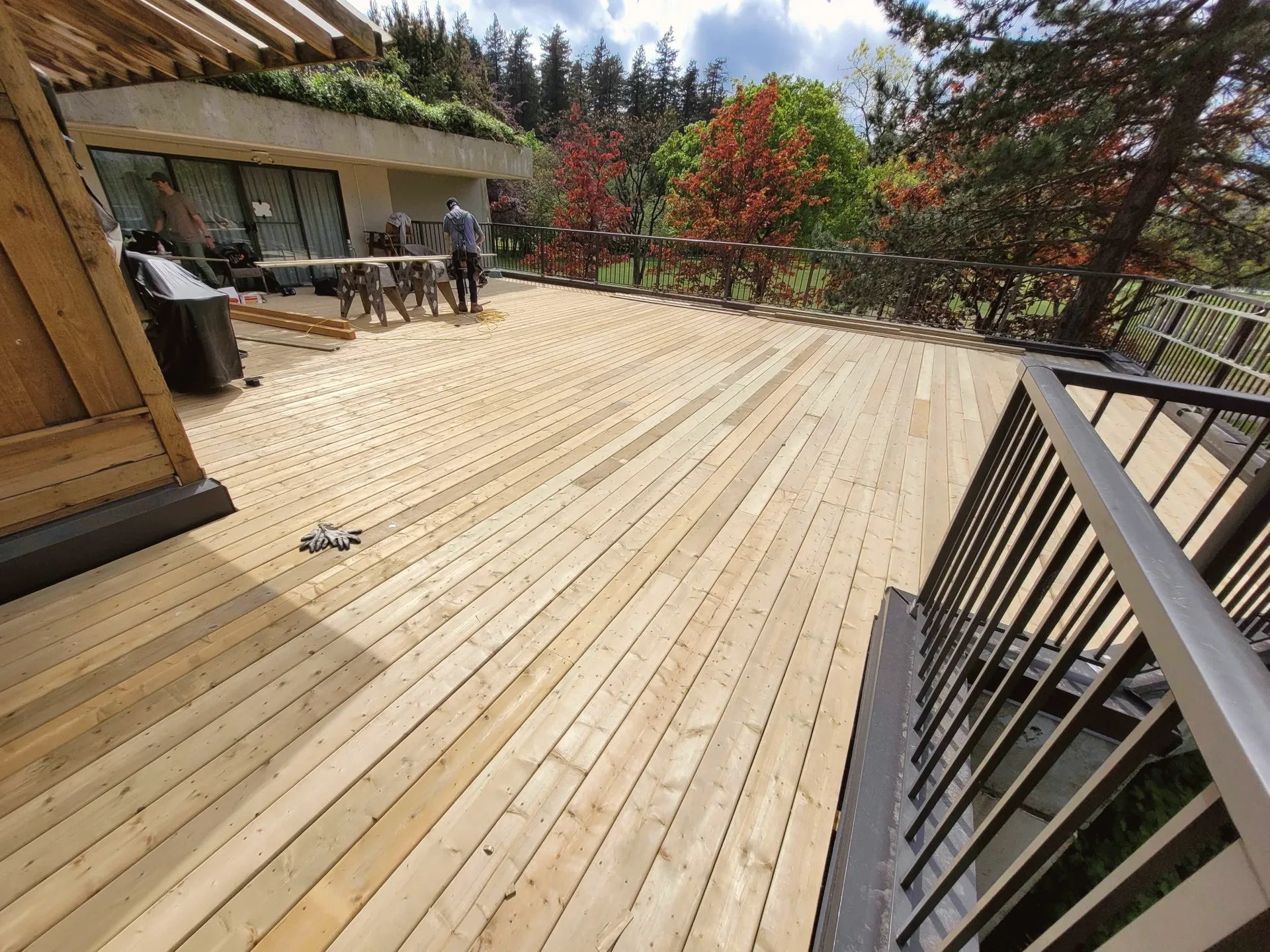 Finished cedar deck with railing after renovation in Metro Vancouver