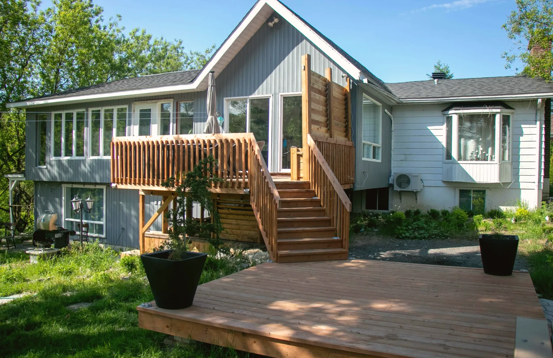 Backyard deck with stairs and privacy screen