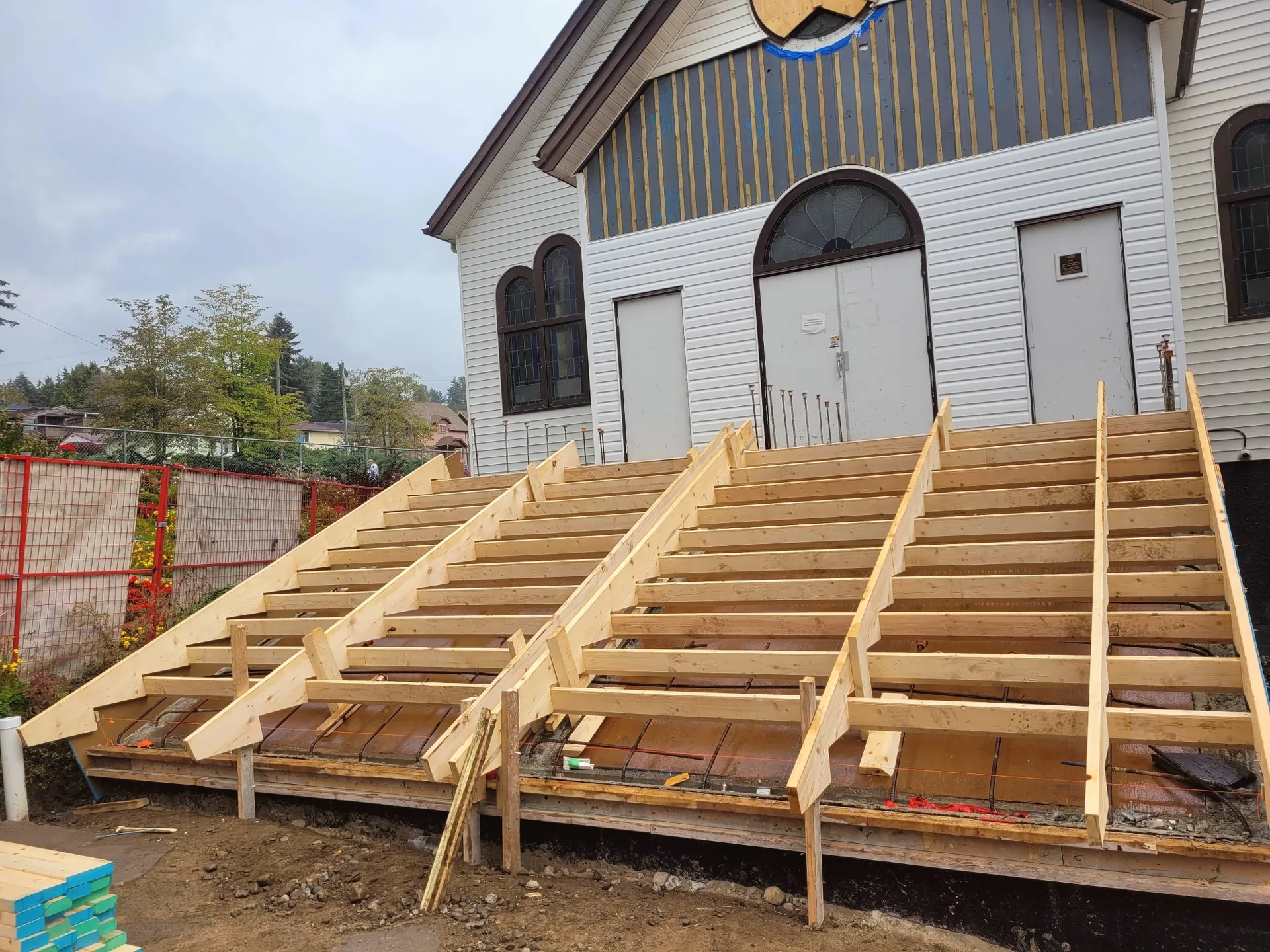 Formwork and stringers prepared for church entrance stairs before concrete